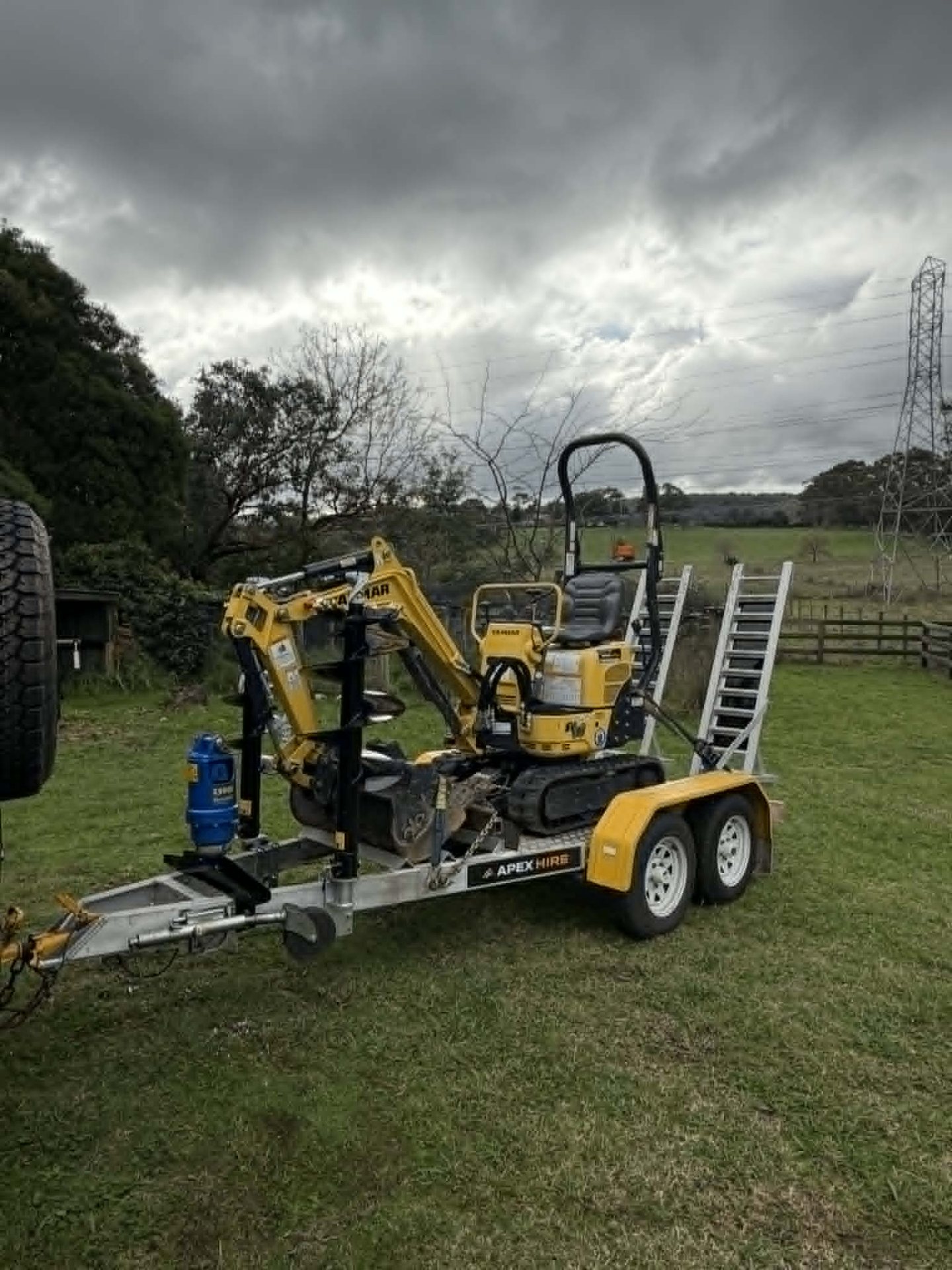 Yanmar SV08 mini excavator strapped to the delivery trailer